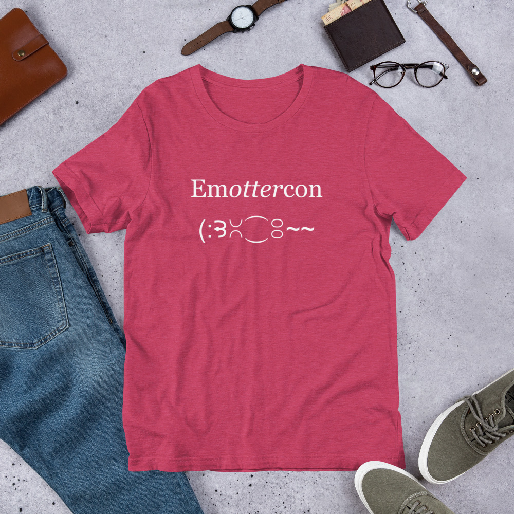 Emottercon Unisex Short-sleeve T-shirt-heather-raspberry-flat | Otter Things Heather raspberry EmOTTERcon T-shirt laid flat with jeans, sneakers, a watch and glasses