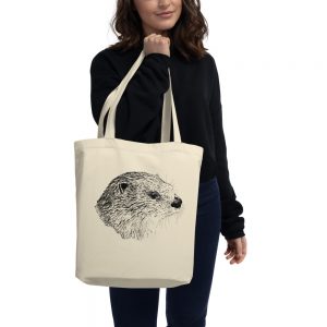 Person carrying the natural Pen & Ink River Otter Head eco tote bag on their shoulder