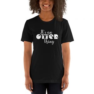 Person wearing the black It's An Otter Thing unisex T-shirt with white script lettering