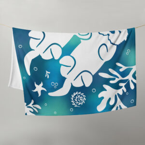 Throw blanket with tie-dyed colored sea otters holding hands hanging over string