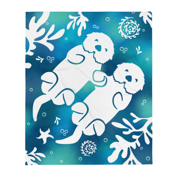 Throw blanket with tie-dyed colored sea otters holding hands and kelp