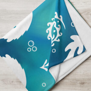 Throw blanket with tie-dyed colored sea otters holding hands and kelp folded