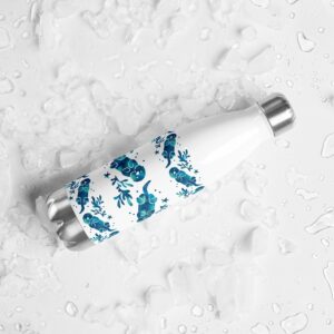 White Sea Otter Tie-Dye Striped water bottle lying on a wet white surface