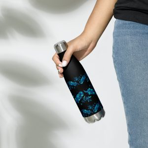A woman holding a Sea Otter Tie-Dye Striped Stainless Steel Water Bottle in black with a silver cap, featuring a repeating pattern of playful blue sea otters and kelp on the sides.