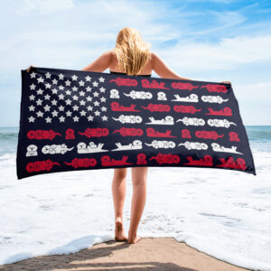 A woman stands on a beach holding the Sea Otter USA Flag Beach Towel, which features rows of red and white sea otters arranged like stars and stripes on the American flag.